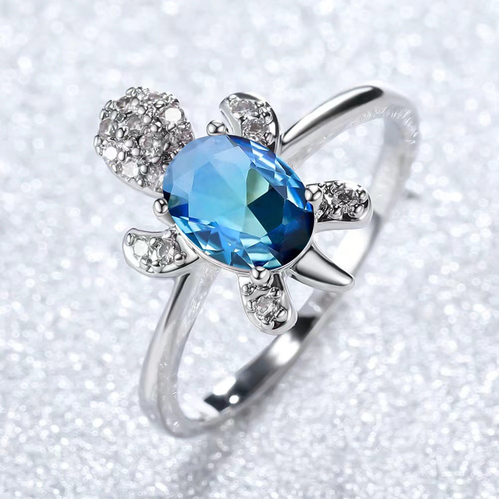 Platinum Ring With A Colored Tortoise Design Featuring Blue Diamondsunisex